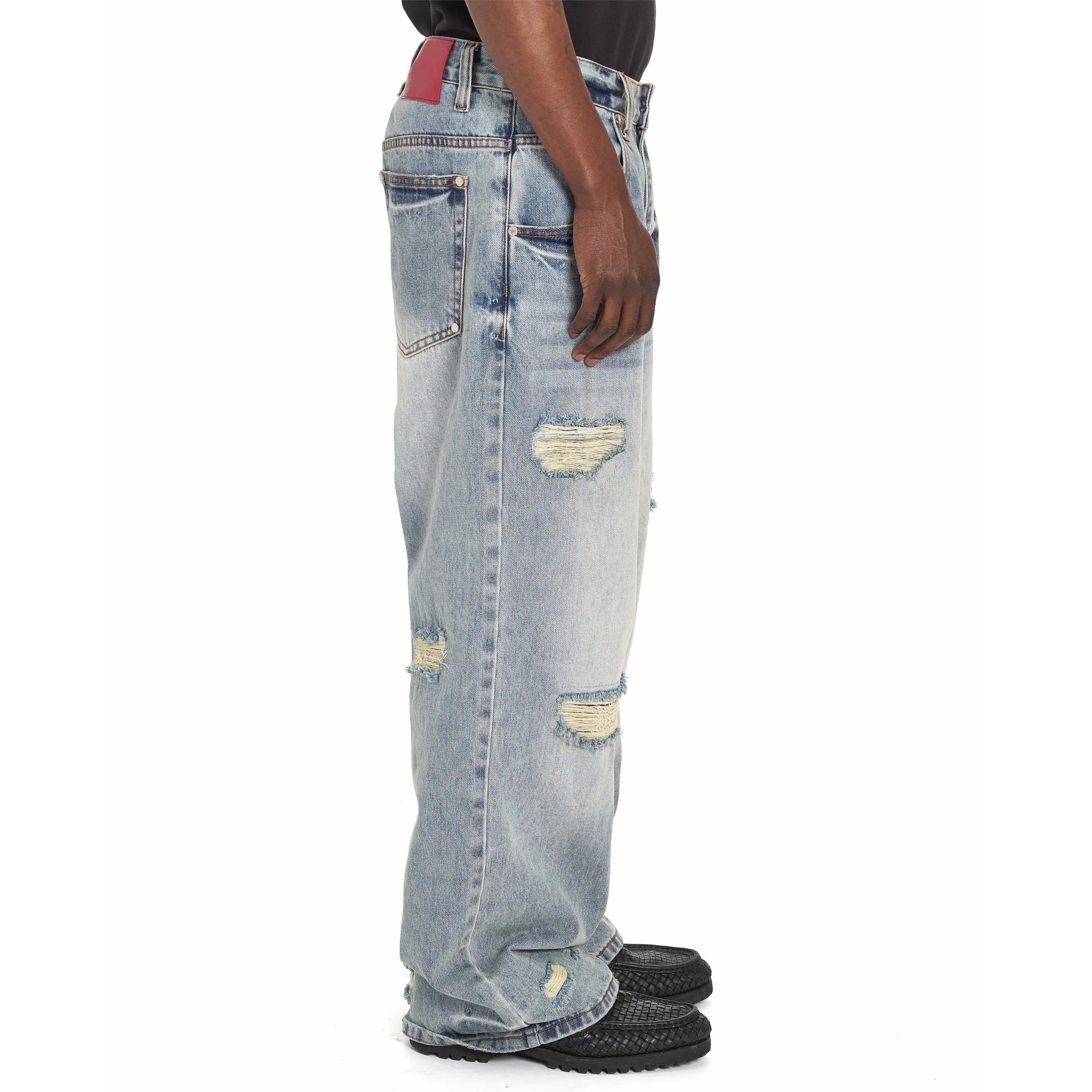 Light Blue Wide-Leg Distressed Jeans with Red Back Patch